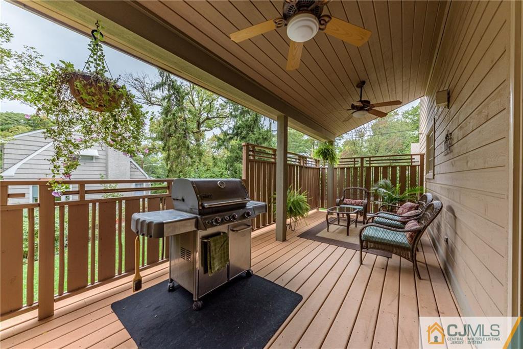 24 East Cliff Road Colonia, NJ 07067 - Photo 39 of 46 a view of balcony with wooden floor and outdoor seating
