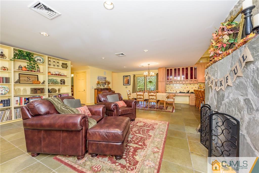 24 East Cliff Road Colonia, NJ 07067 - Photo 5 of 46 a living room with furniture and a large window
