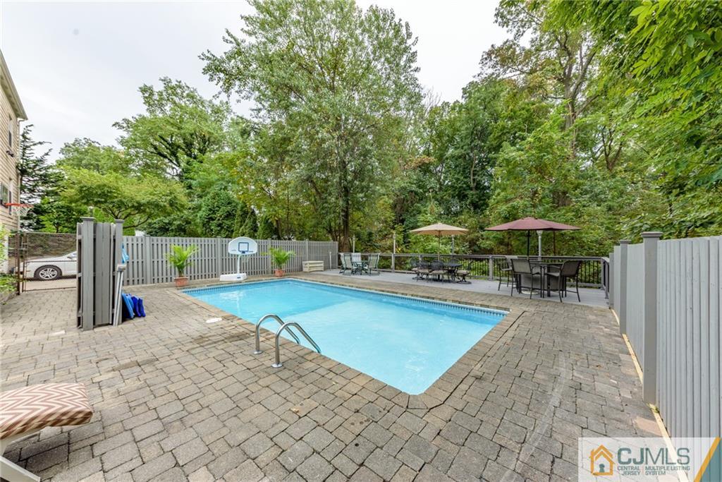 24 East Cliff Road Colonia, NJ 07067 - Photo 41 of 46 a view of a backyard with swimming pool