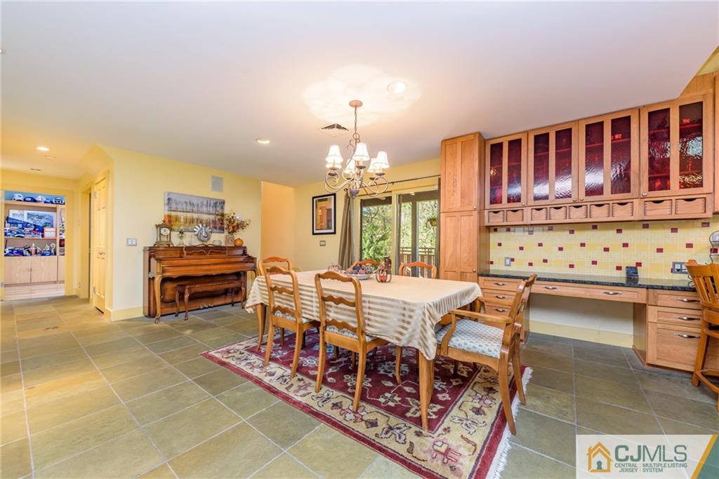 24 East Cliff Road Colonia, NJ 07067 - Photo 6 of 46 a dinning area with furniture and chandelier