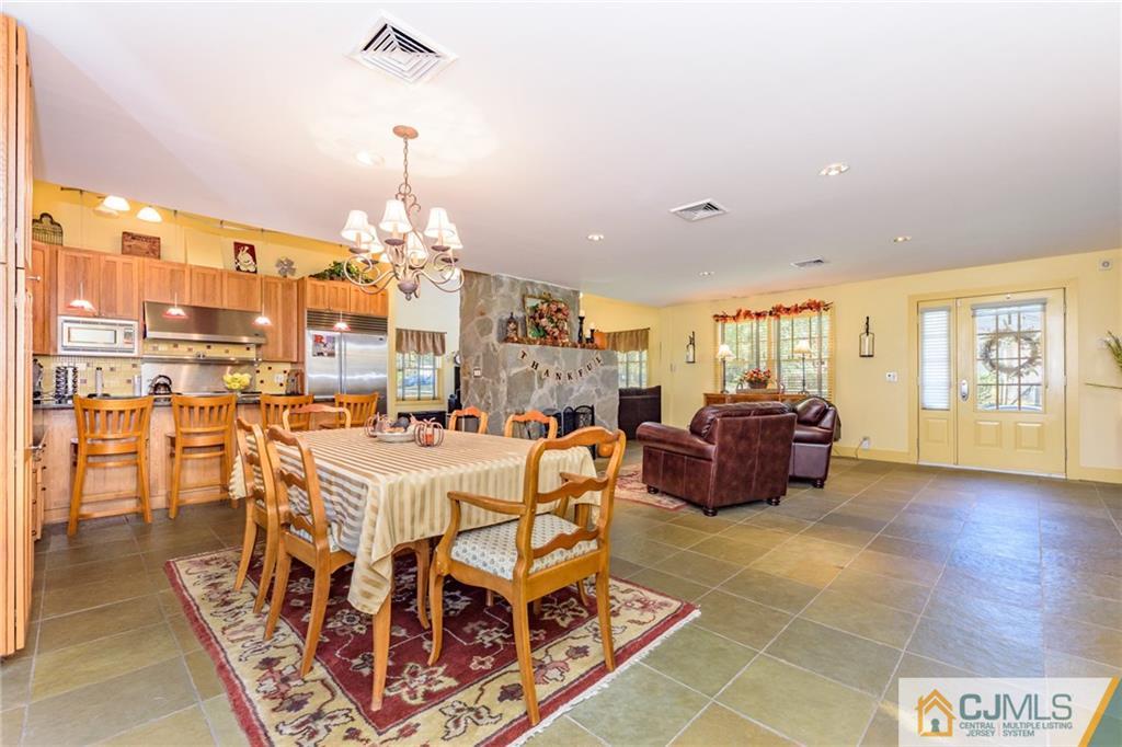 24 East Cliff Road Colonia, NJ 07067 - Photo 7 of 46 a living room with lots of furniture and a chandelier