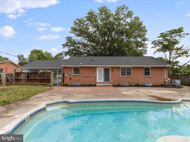a house that has sitting area in front of it