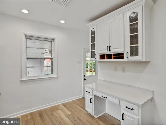 a view of cabinets and window