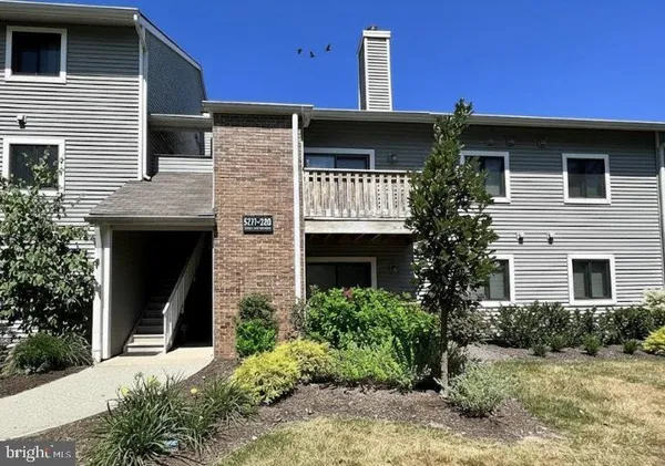 a front view of a house with yard