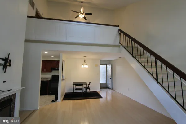 a hallway with windows and couches