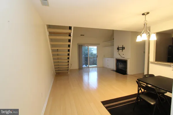 a view of a living room with furniture and a flat screen tv
