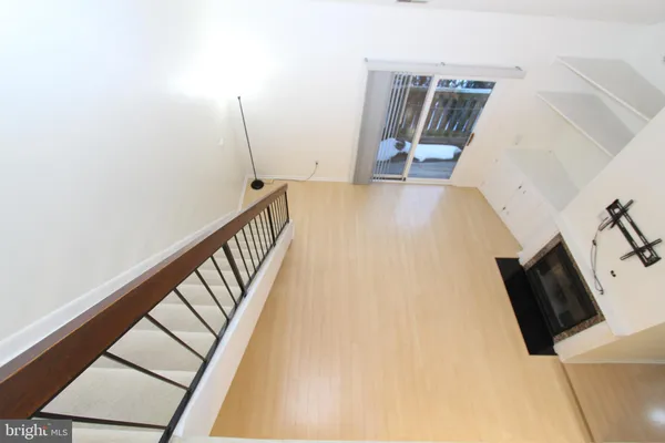 a view of a hardwood and staircase