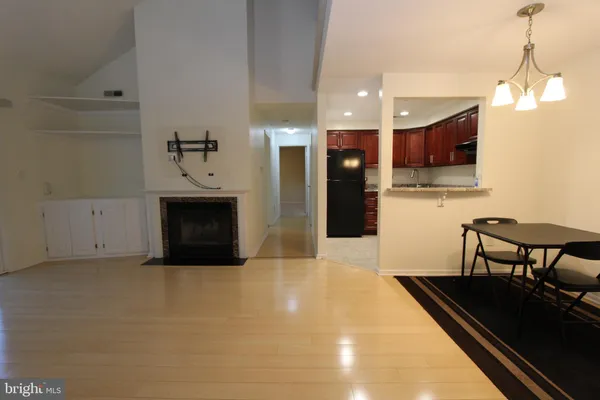 a kitchen with furniture and a fireplace