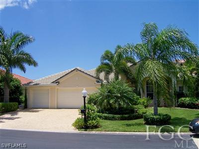 11620 Compass Point Drive Fort Myers, FL 33908 - Photo 1 of 10 a view of a chair and table with potted plants in front of house