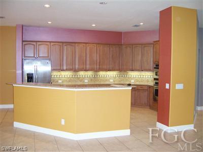 11620 Compass Point Drive Fort Myers, FL 33908 - Photo 9 of 10 a view of kitchen with wooden floor