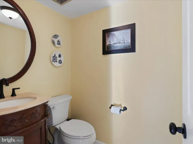a bathroom with a toilet and a sink