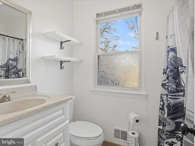 a bathroom with a toilet and a sink