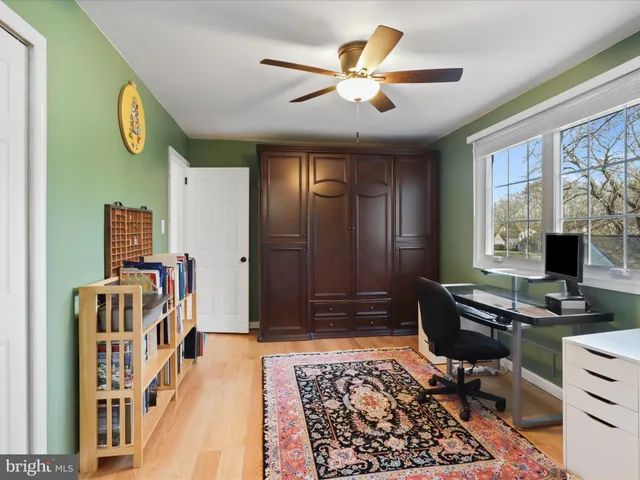 a bedroom with furniture and a window