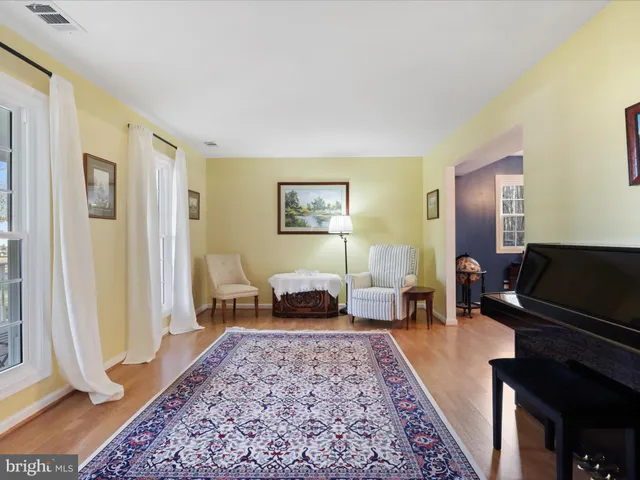 a living room with furniture and a rug