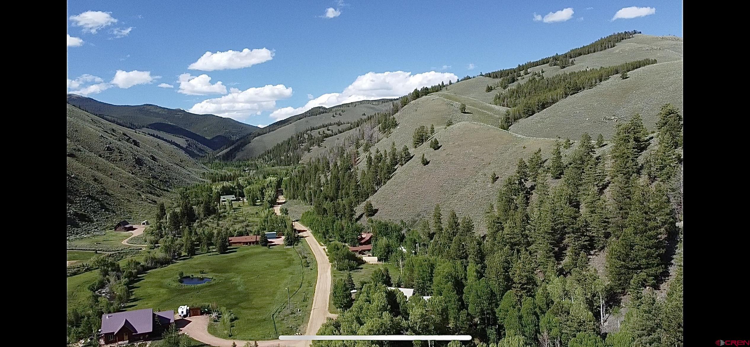 48 County Road 771 Ohio City, CO 81237 - Photo 15 of 31 a view of a house with a yard and swimming pool