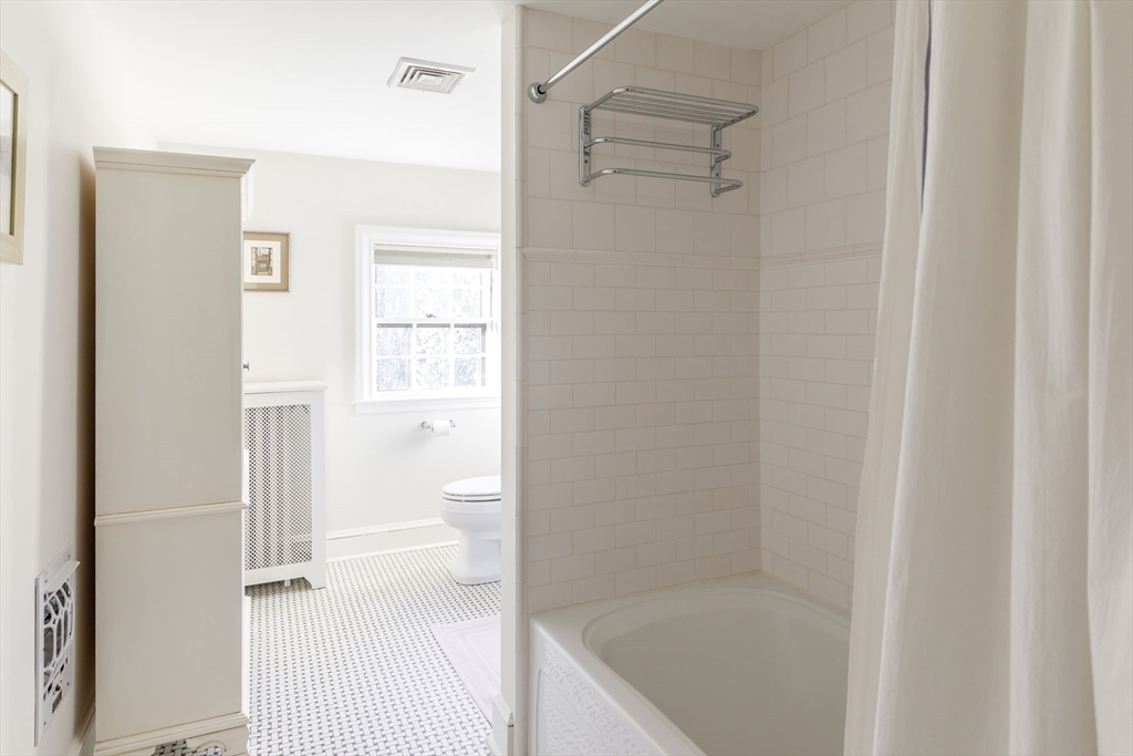 6 Risley Road Newton, MA 02465 - Photo 12 of 21 a bathroom with a bathtub
