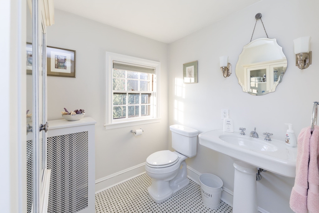 6 Risley Road Newton, MA 02465 - Photo 13 of 21 a bathroom with a sink a toilet and a mirror
