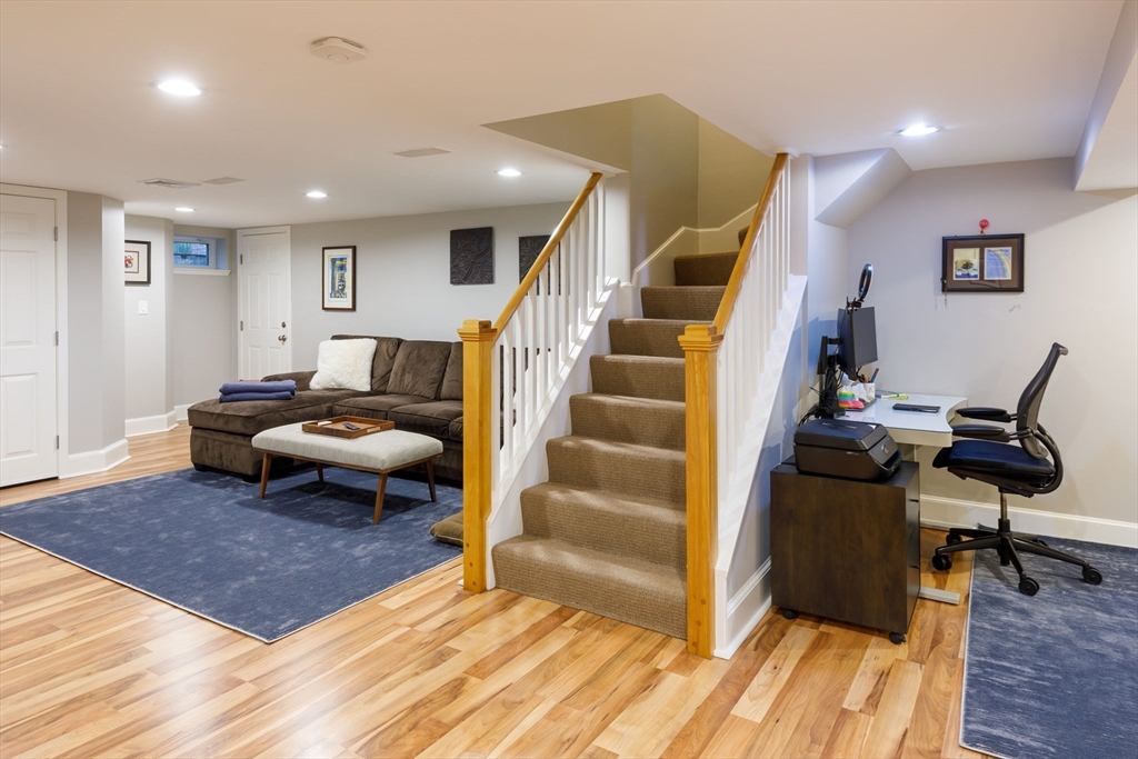 6 Risley Road Newton, MA 02465 - Photo 15 of 21 a living room with furniture and a wooden floor
