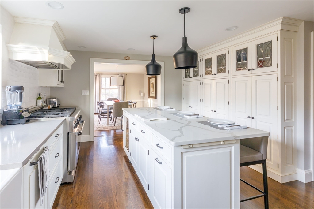 6 Risley Road Newton, MA 02465 - Photo 2 of 21 a kitchen with kitchen island a sink stove and wooden floor