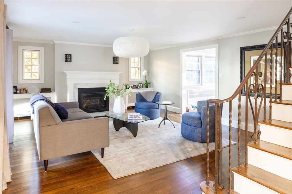 6 Risley Road Newton, MA 02465 - Photo 4 of 21 a living room with furniture a fireplace and a large window