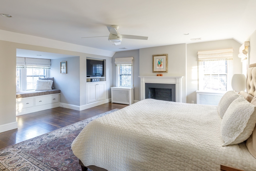 6 Risley Road Newton, MA 02465 - Photo 7 of 21 a spacious bedroom with a large bed and a wooden floor