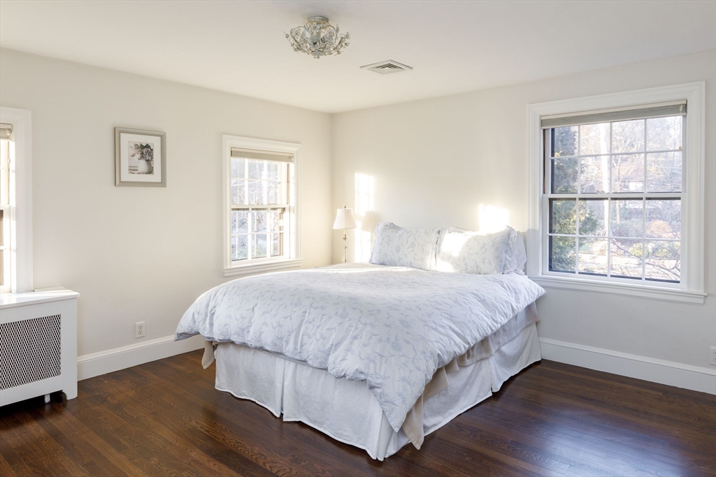 6 Risley Road Newton, MA 02465 - Photo 10 of 21 a bedroom with a bed and wooden floor