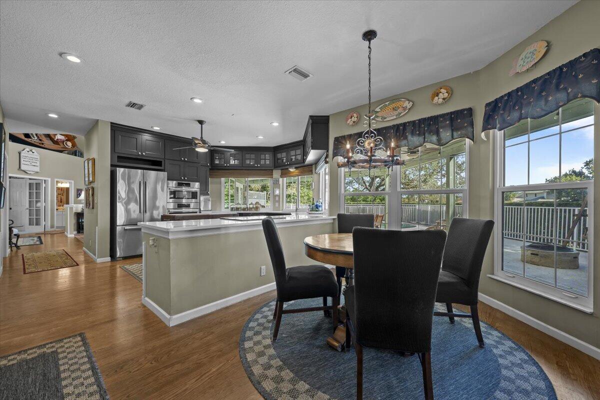 7 Alnwick Road Palm Beach Gardens, FL 33418 - Photo 11 of 47 a dining room with furniture window wooden floor