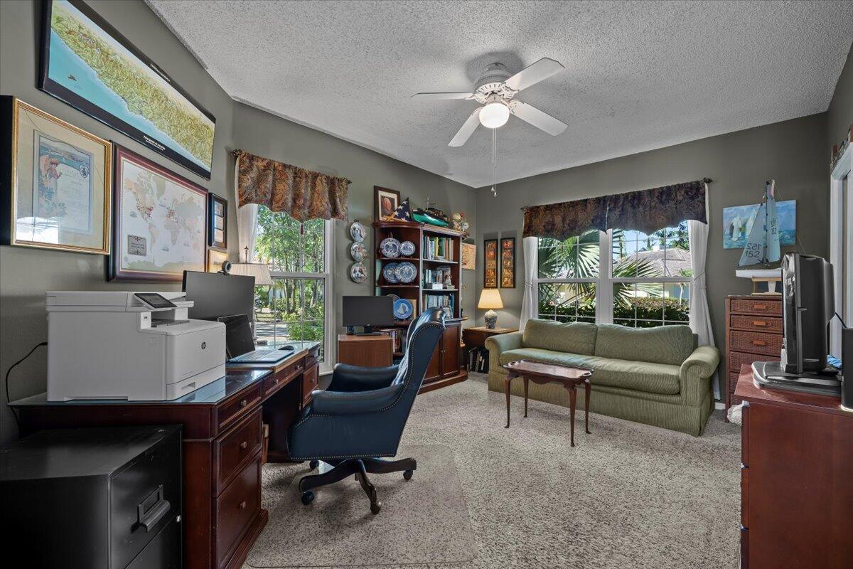 7 Alnwick Road Palm Beach Gardens, FL 33418 - Photo 16 of 47 a work room with furniture and a large window