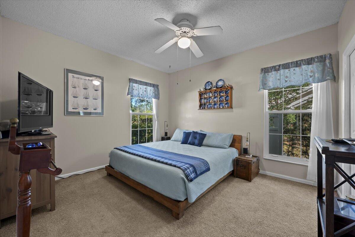 7 Alnwick Road Palm Beach Gardens, FL 33418 - Photo 19 of 47 a bedroom with a bed and a couch