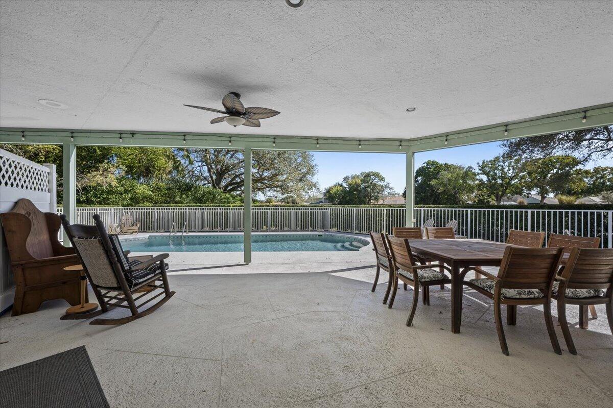 7 Alnwick Road Palm Beach Gardens, FL 33418 - Photo 33 of 47 a view of a chairs and table in patio