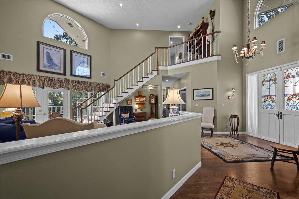 7 Alnwick Road Palm Beach Gardens, FL 33418 - Photo 5 of 47 a view of a livingroom with furniture a flat screen tv and windows