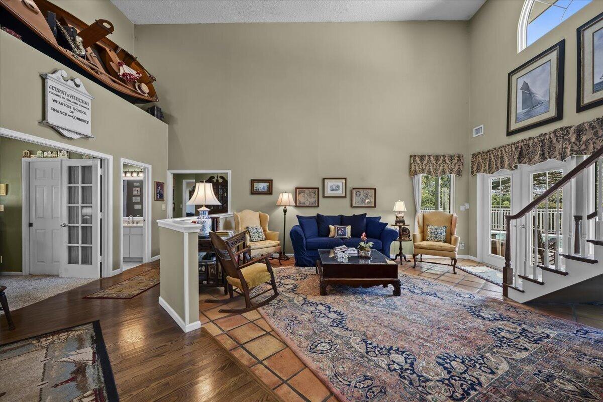 7 Alnwick Road Palm Beach Gardens, FL 33418 - Photo 6 of 47 a living room with furniture and a flat screen tv