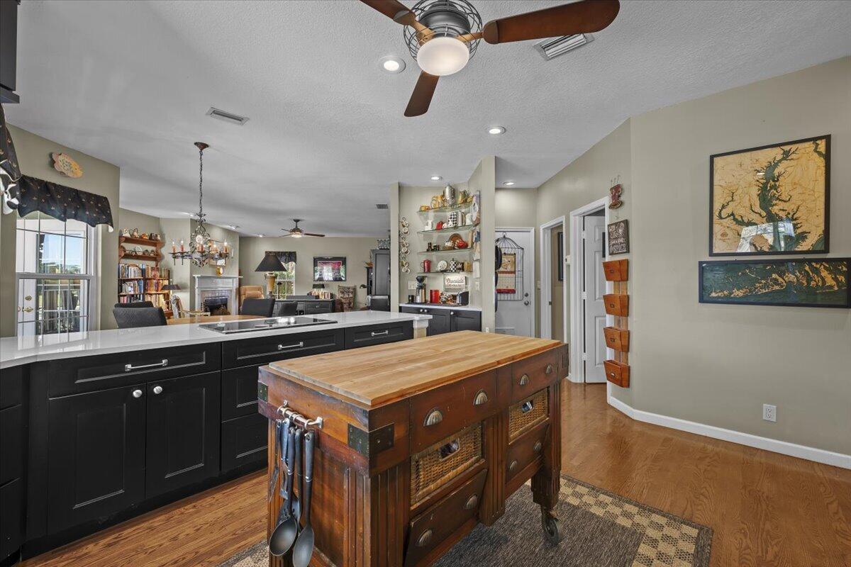 7 Alnwick Road Palm Beach Gardens, FL 33418 - Photo 9 of 47 a kitchen that has a lot of cabinets in it