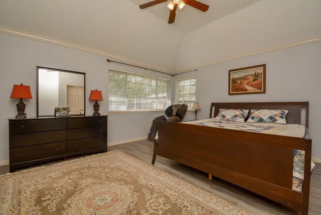 a bed room with a bed and a dresser