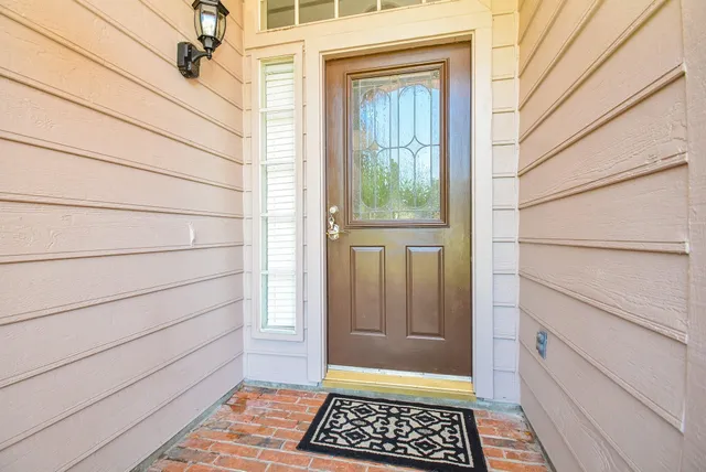 a view of a door and a window
