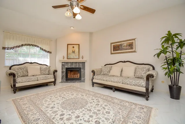 a living room with furniture and a fireplace