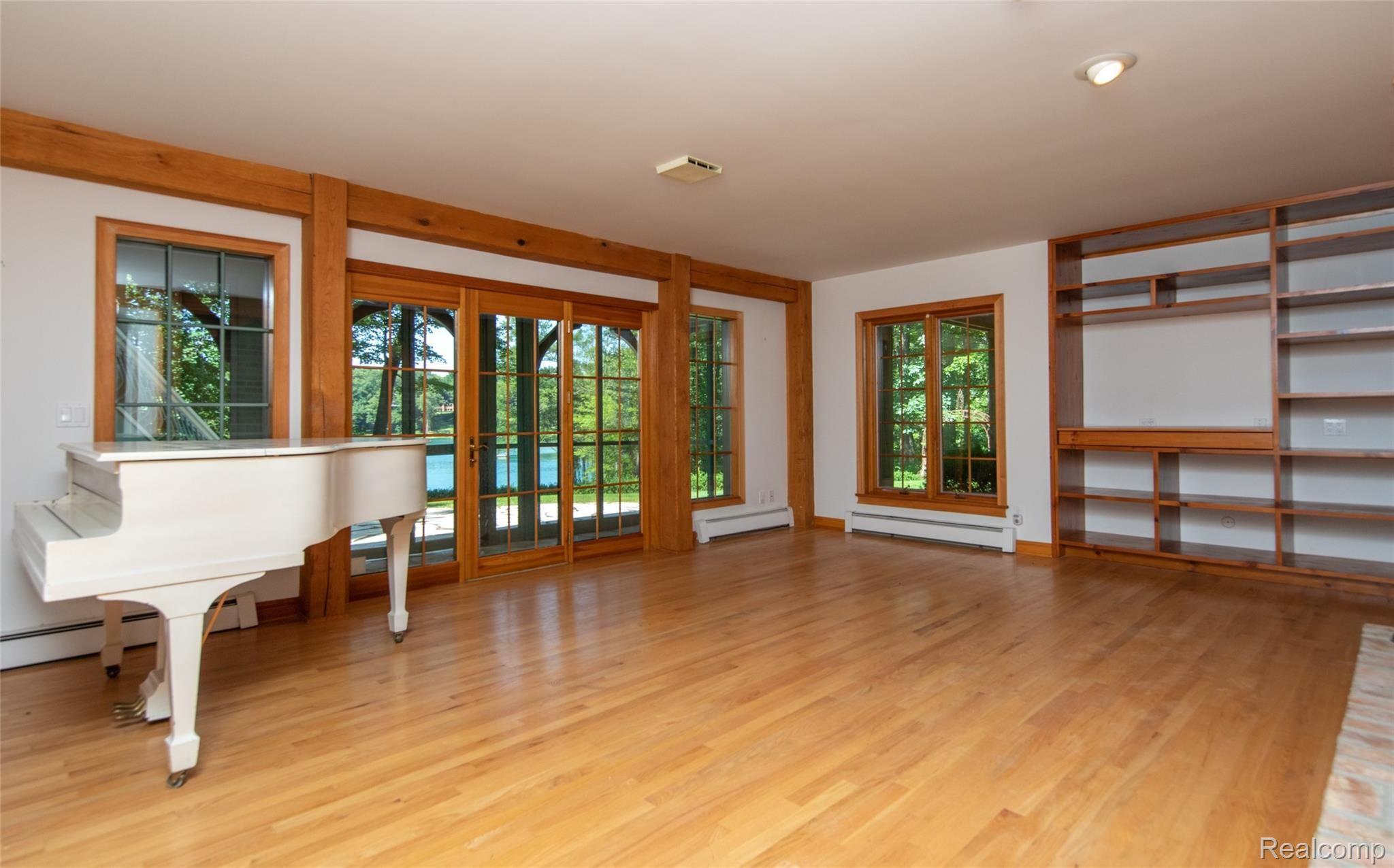 1515 Addaleen Road Highland, MI 48357 - Photo 36 of 48 Enormous Lower Level with Hardwood provides an Additional Level of Living Space