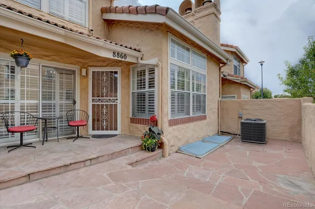 a view of a house with outdoor sitting area
