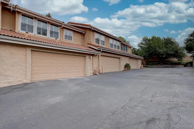 a tall building with a large window and balcony