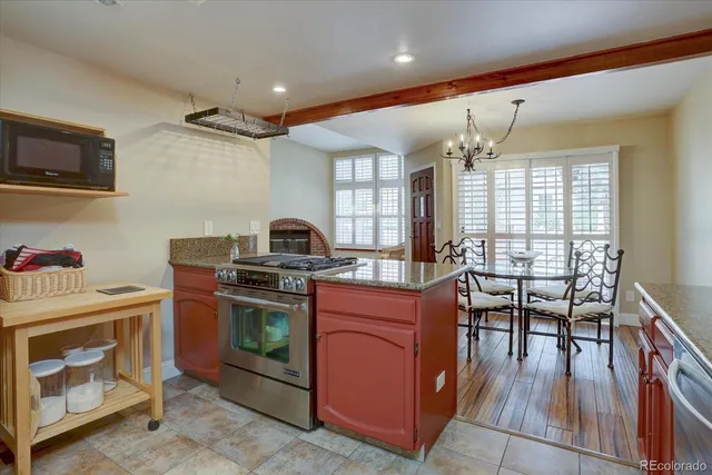 a kitchen with stove and cabinets