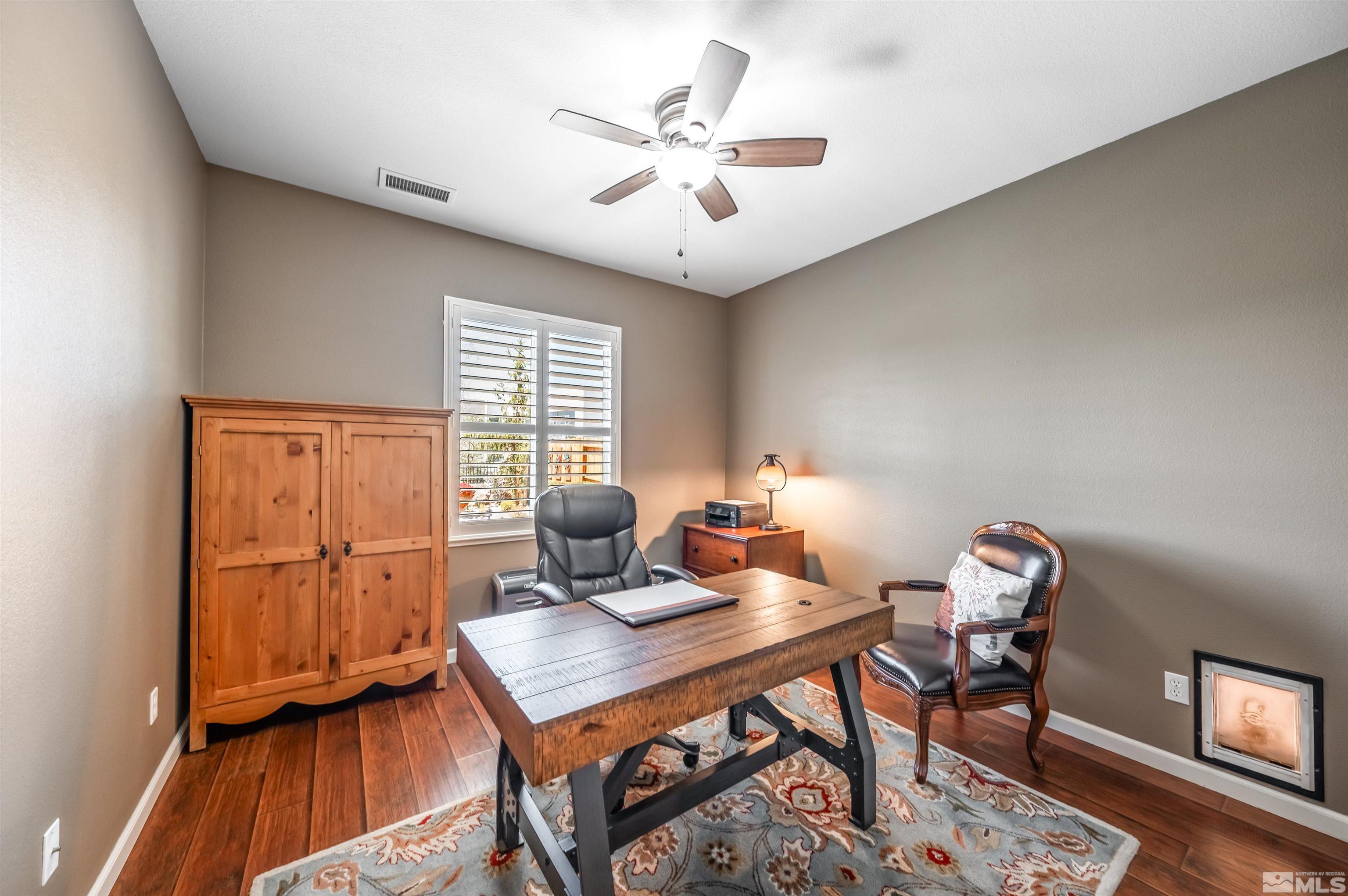 9375 Spotted Horse Road Reno, NV 89521 - Photo 17 of 33 a workspace with furniture and wooden floor