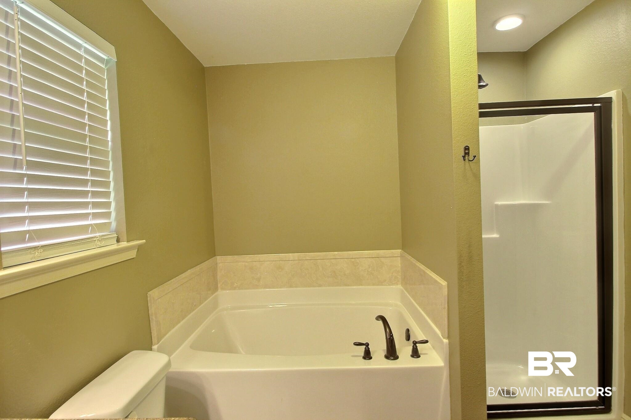 15577 Talus Court Foley, AL 36535 - Photo 17 of 28 Bathroom featuring a shower stall and a garden tub