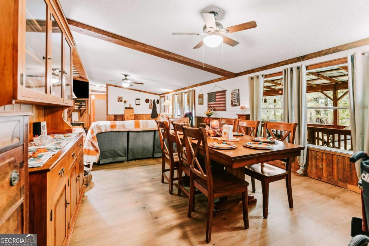 5971 Penfield Road Union Point, GA 30669 - Photo 13 of 42 a dining room with stainless steel appliances a table and chairs