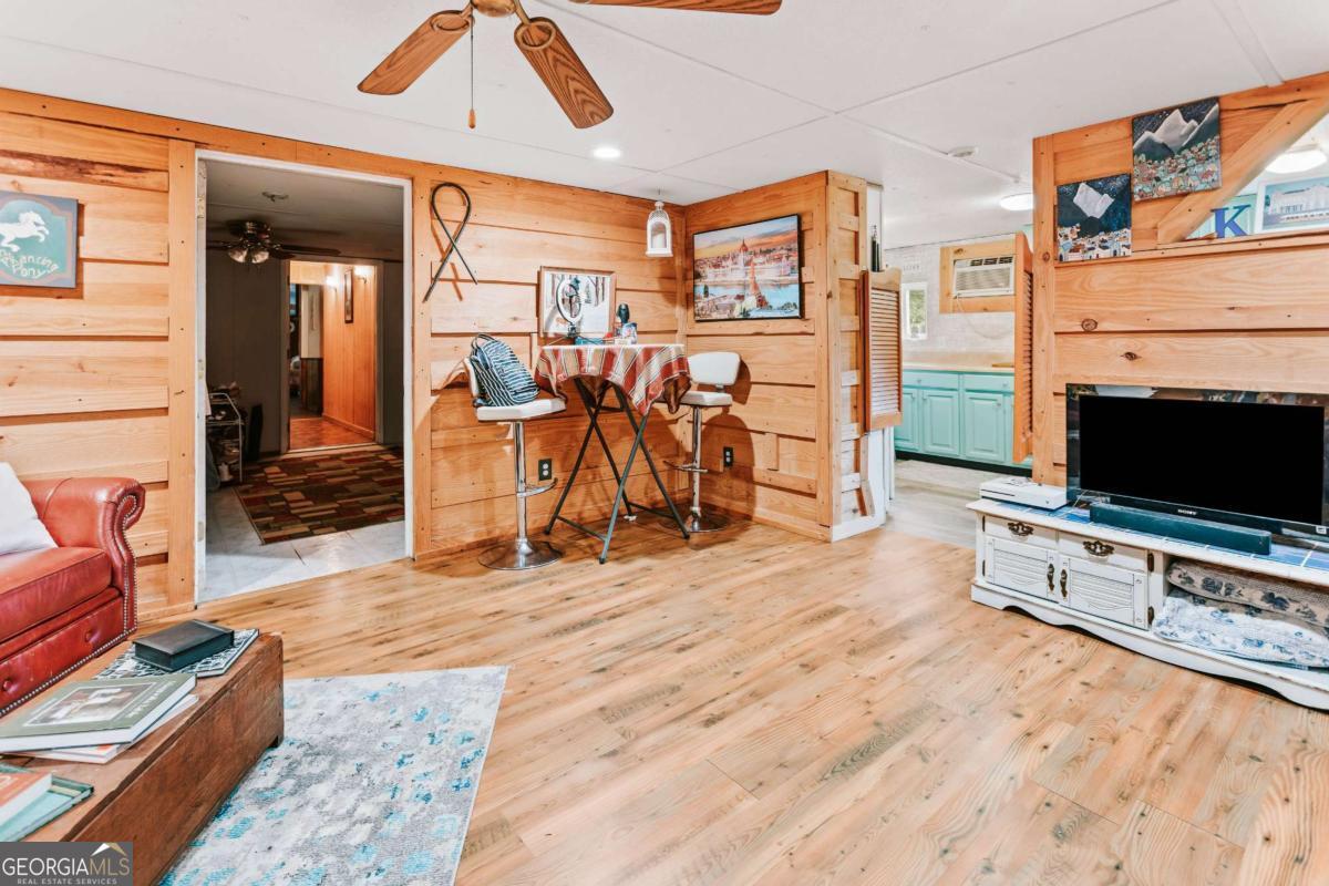 5971 Penfield Road Union Point, GA 30669 - Photo 30 of 42 a view of a livingroom with furniture and a flat screen tv