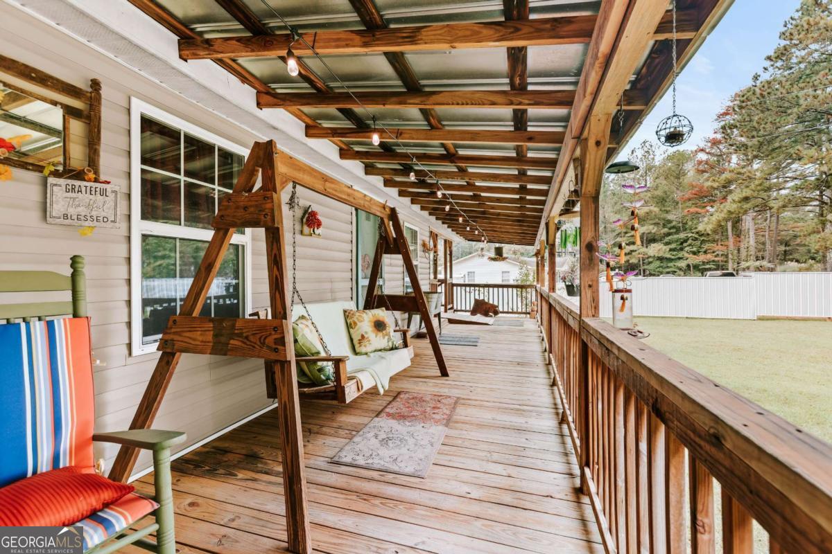 5971 Penfield Road Union Point, GA 30669 - Photo 34 of 42 a view of a balcony with chairs