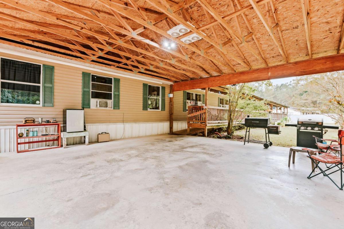 5971 Penfield Road Union Point, GA 30669 - Photo 38 of 42 a view of a chairs with table in front of house