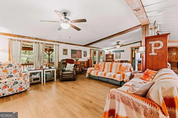 a bedroom with furniture and wooden floor