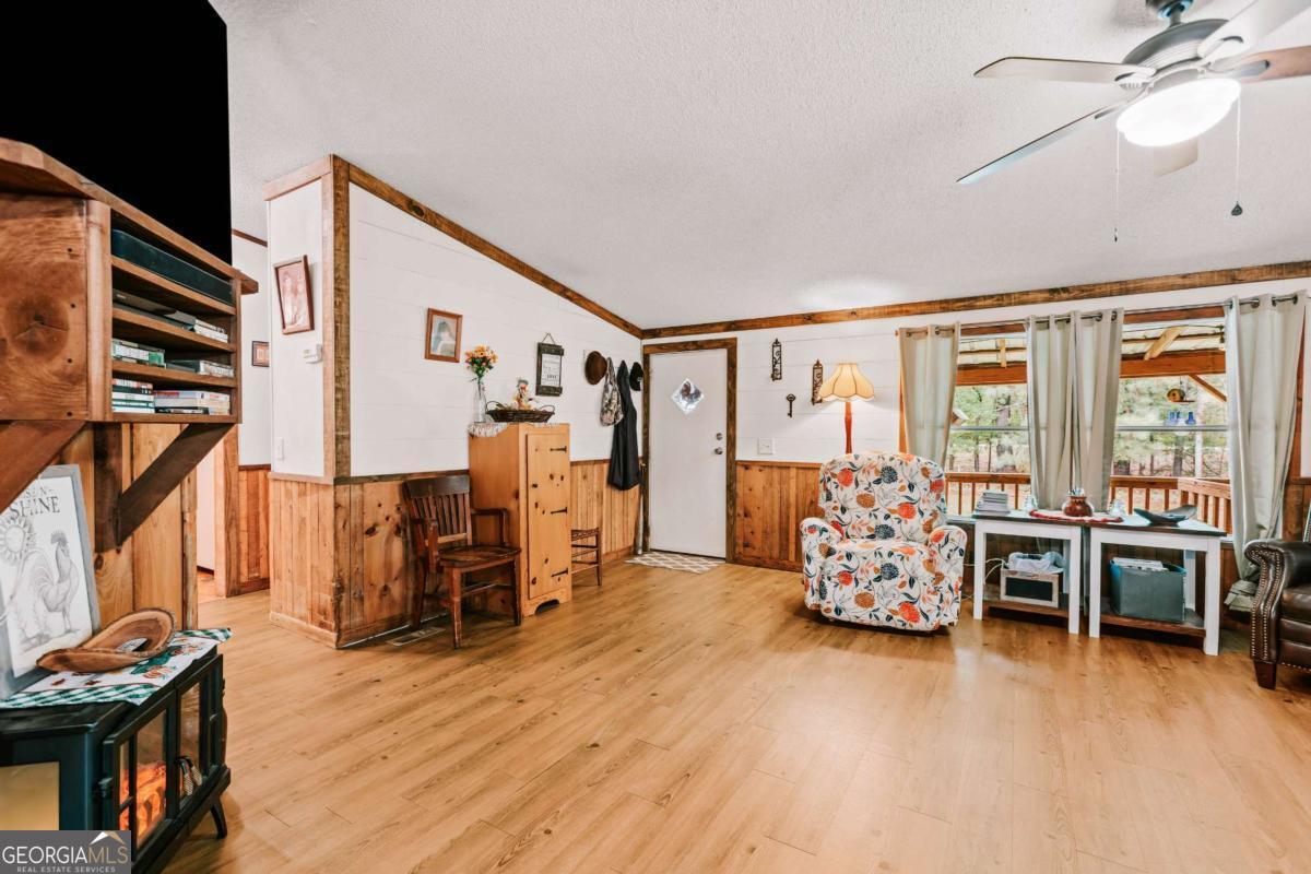 5971 Penfield Road Union Point, GA 30669 - Photo 5 of 42 a bed room with furniture and a window