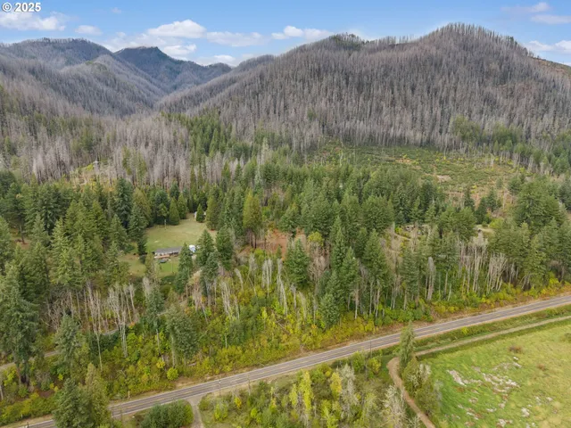 a view of a town with mountains in the background