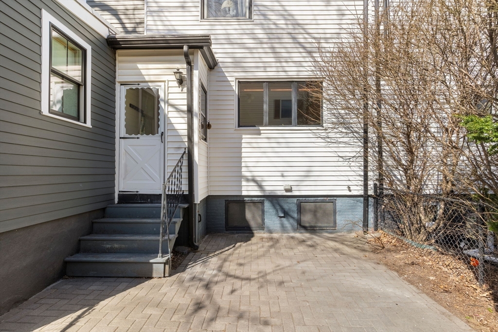 56 Spring Street, Unit 56 Cambridge, MA 02141 - Photo 12 of 15 a view of a house with entryway and stairs